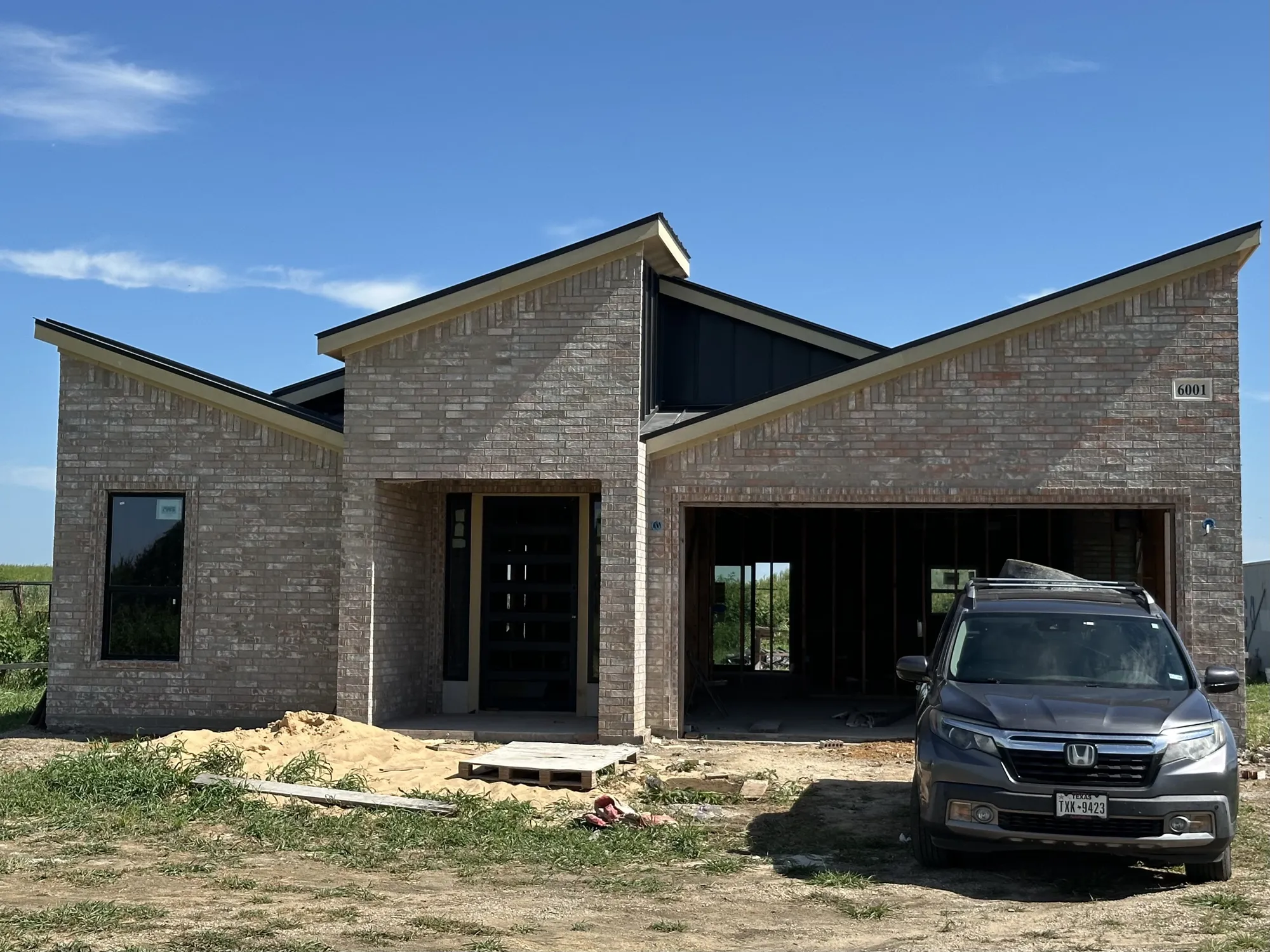 New home build in progress showing framing and early construction stages