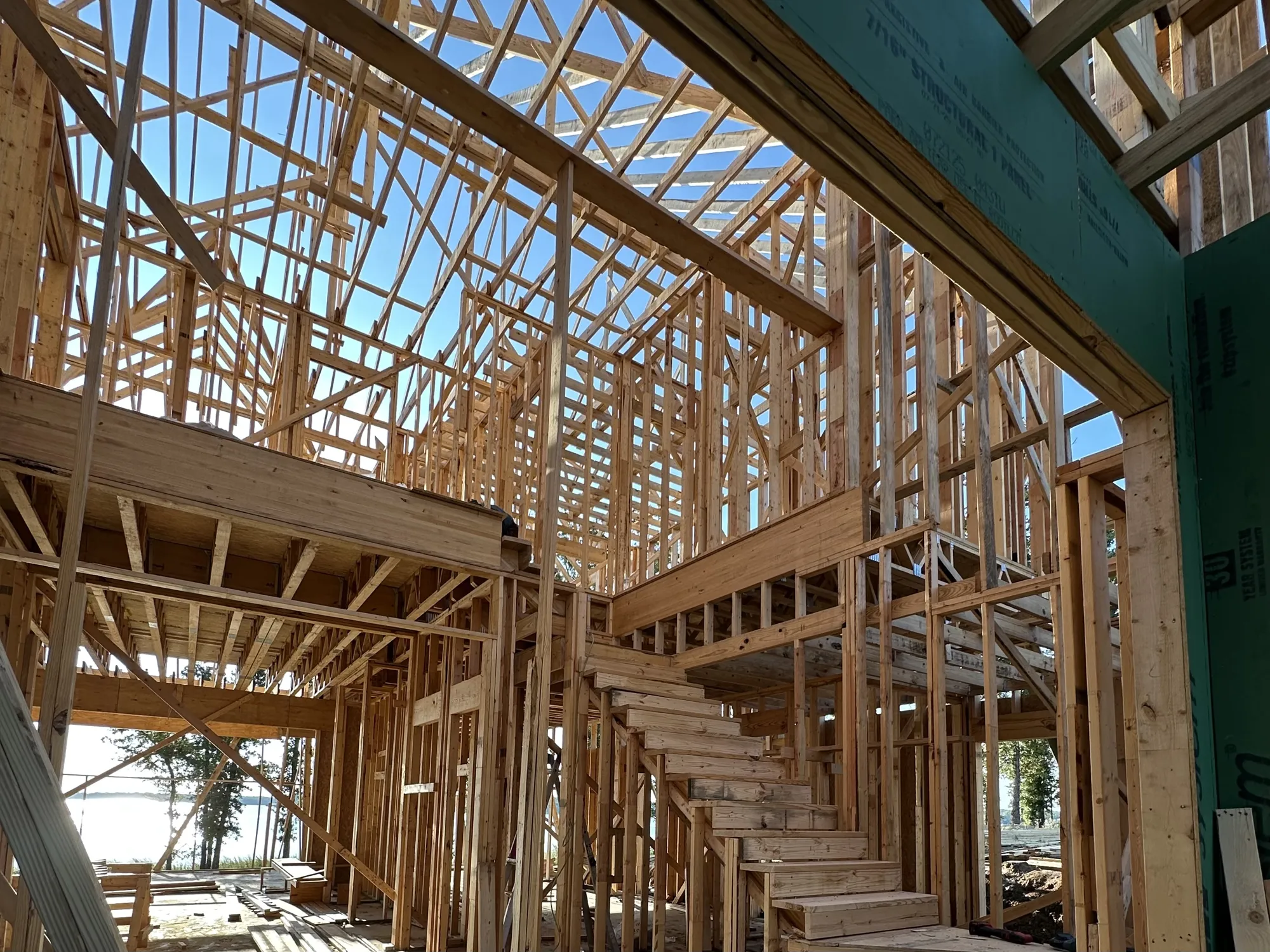 Engineered beams and headers installed for custom home framing support