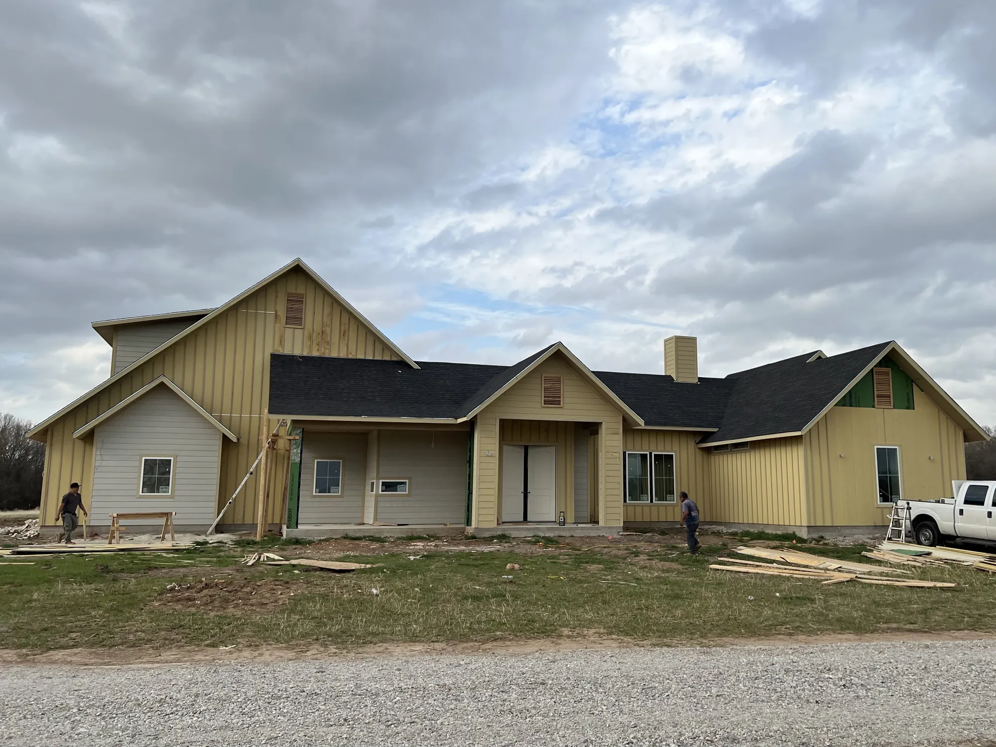 New home framing with exposed wood framing, roof structure, and load-bearing walls